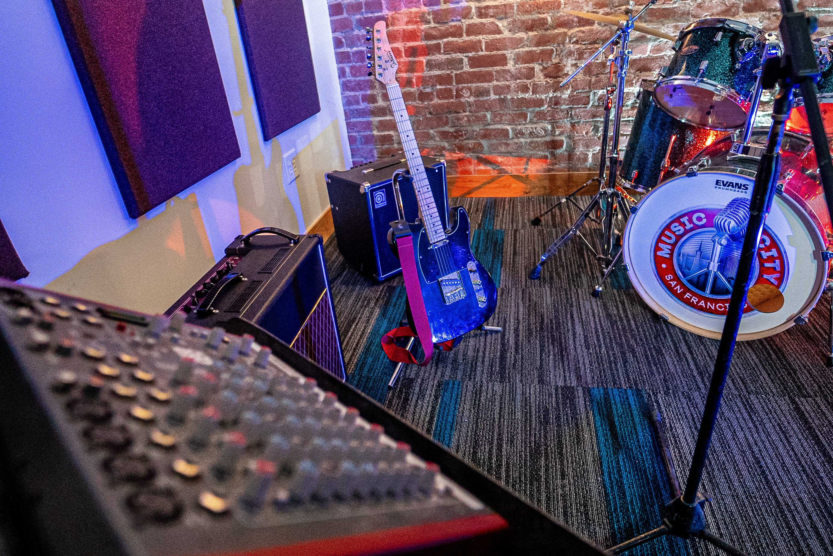 A room with musical instruments and sound equipment