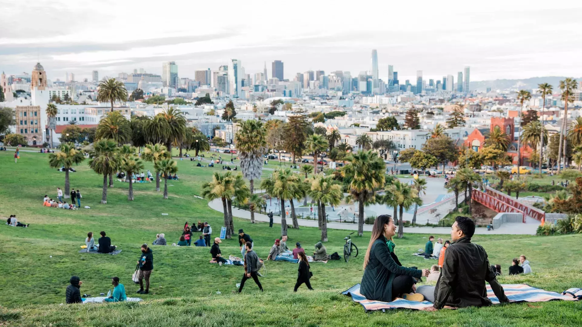 A city skyline view with a park in the foreground